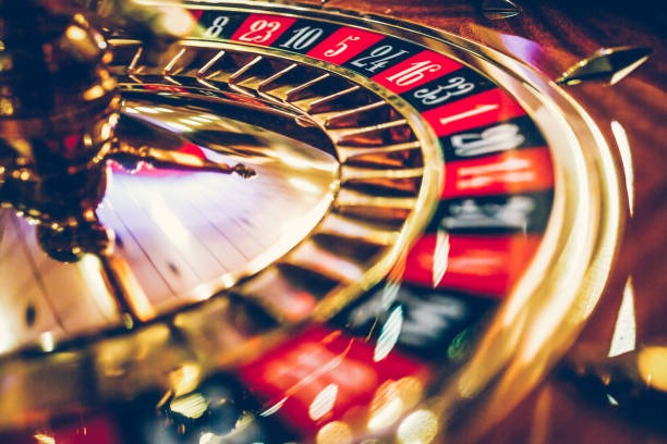Wild Bandito live dealer studio showing Dragon Tiger, Sic Bo, and roulette tables on dotatogel login